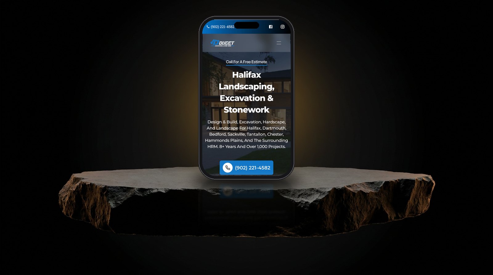 Doucet Landscaping website shown on a phone